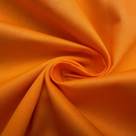 Close-up orange twill hat fabric texture